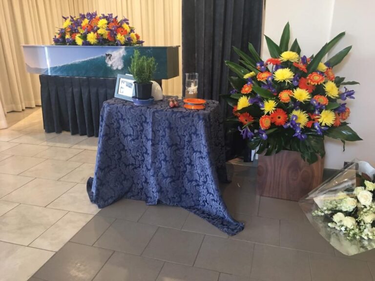 Chapel set with a blue-clothed table and flowers